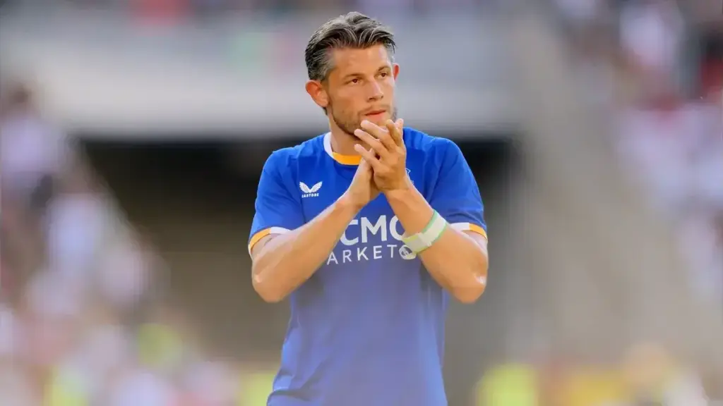 Everton unbeaten start: James Tarkowski in an Everton kit clapping during a match.