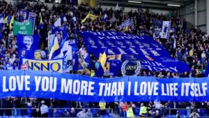Everton Multi-Academy Trust: Everton supporters displaying large banners in the stands at Goodison Park