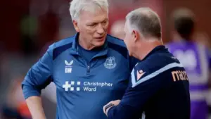 Everton unbeaten start: David Moyes in Everton training/match context speaking with another coach